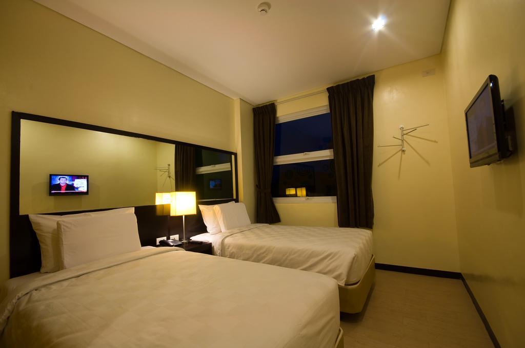 Go Hotels Puerto Princesa Rum bild